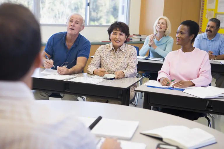 mature-students-their-teacher-classroom-5947899